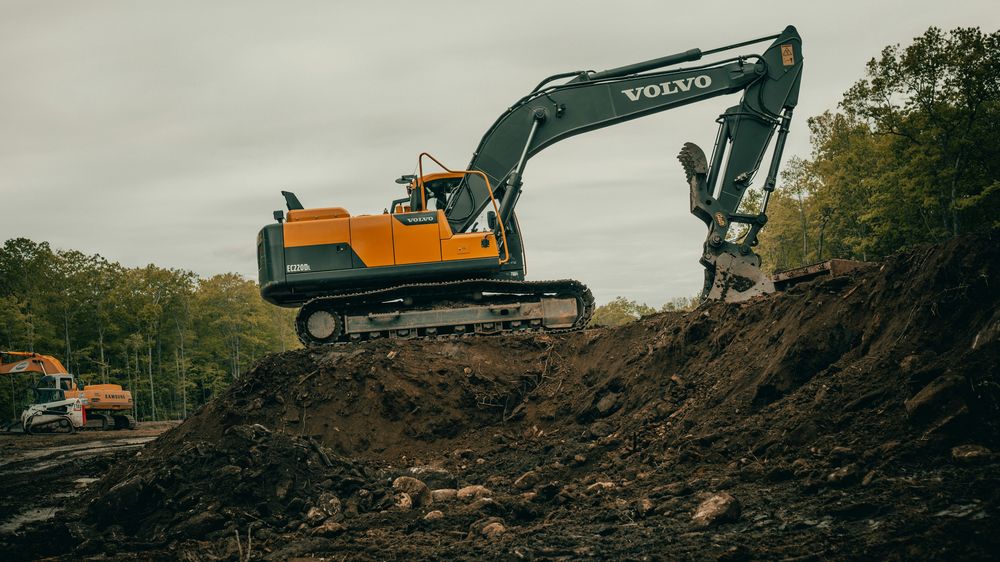 Large excavator moving earth at a work site